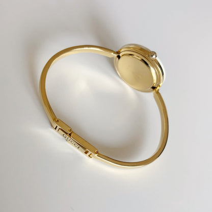 Gucci 1990s Interchangeable Bezel Gold Plated Bangle Watch with 12 bezels, case