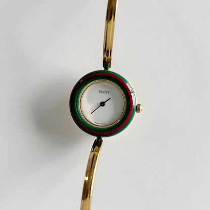 Gucci 1990s Interchangeable Bezel Gold Plated Bangle Watch with 12 bezels, case