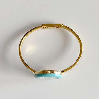 Gucci 1990s Interchangeable Bezel Gold Plated Bangle Watch with 12 bezels, case