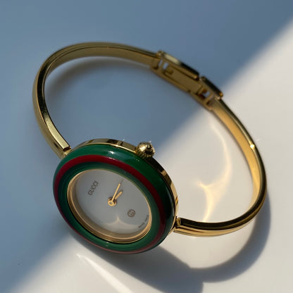Gucci 1990s Interchangeable Bezel Gold Plated Bangle Watch with 12 bezels, case
