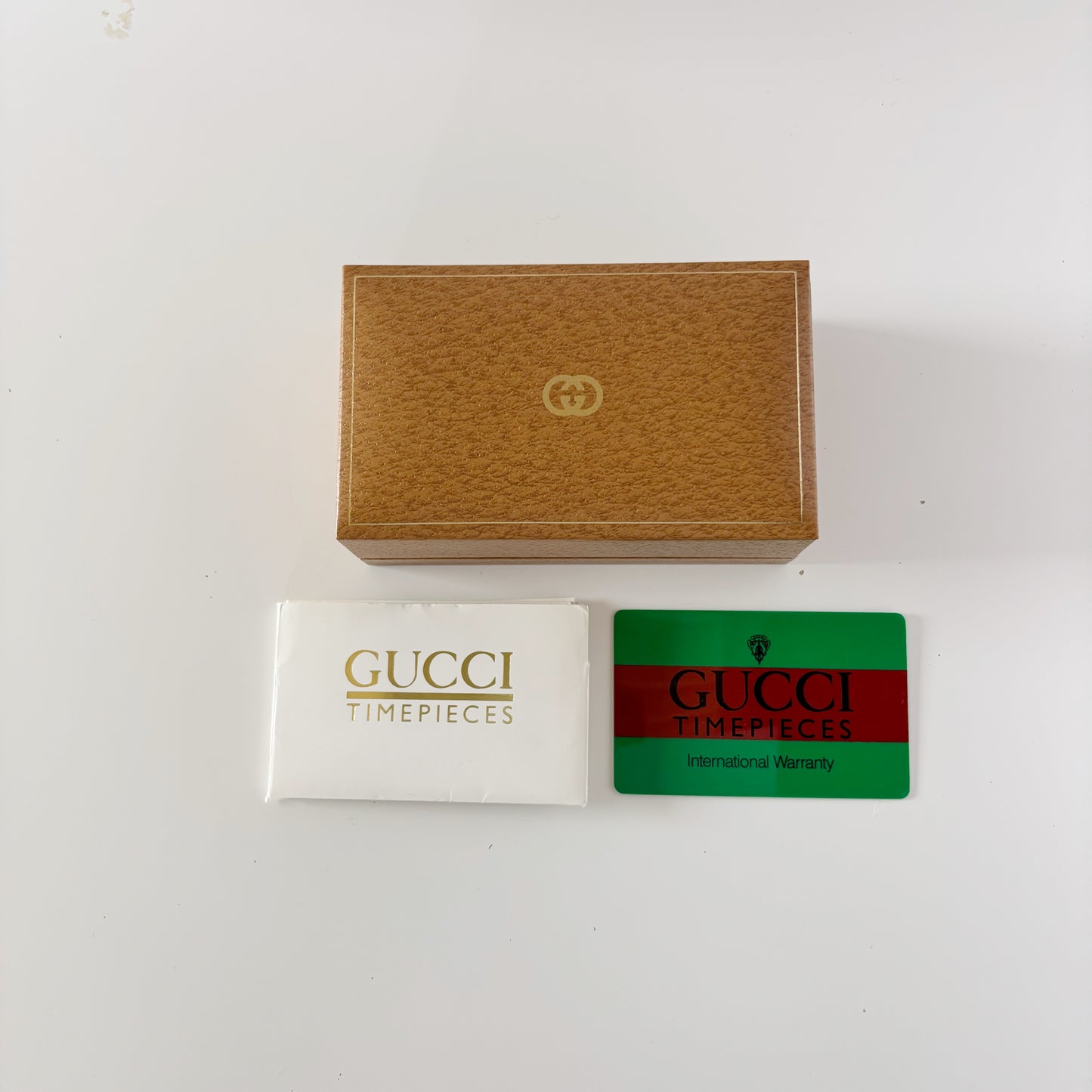 Gucci 1980s Interchangeable Bezel Gold Plated Bangle Watch with 12 bezels, case