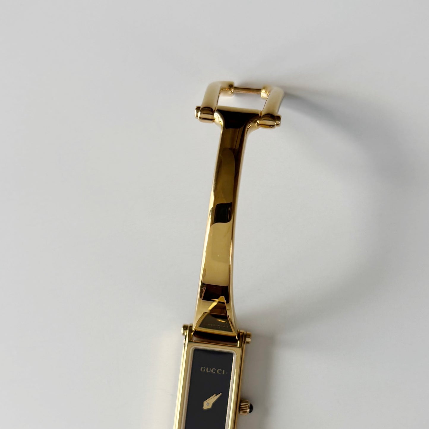 Gucci 1990s Black Rectangular Dial Gold Plated Bangle Watch