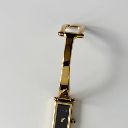 Gucci 1990s Black Rectangular Dial Gold Plated Bangle Watch
