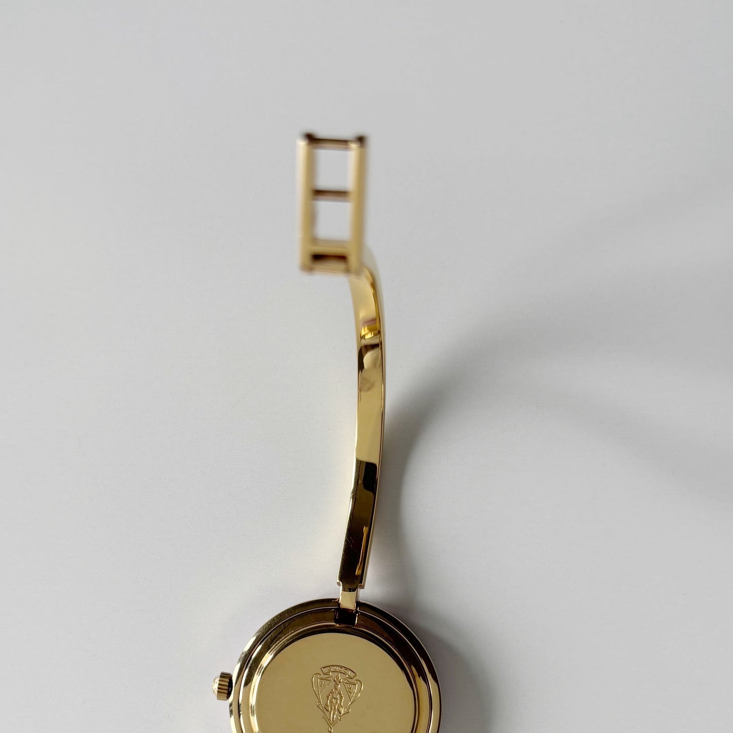 Gucci 1990s Interchangeable Bezel Gold Plated Bangle Watch with 12 bezels, case