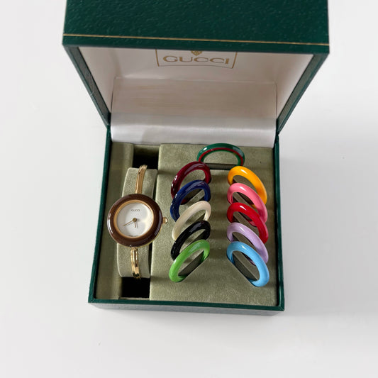 Gucci 1990s Interchangeable Bezel Gold Plated Bangle Watch with 12 bezels, case