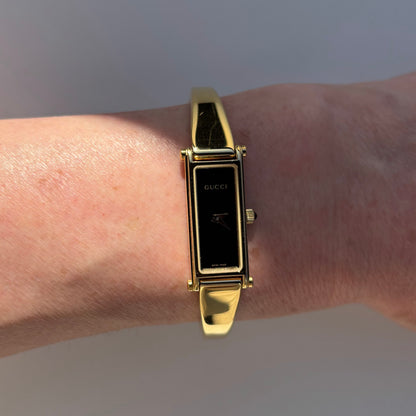 Gucci 1990s Black Dial Gold Plated Bangle Watch