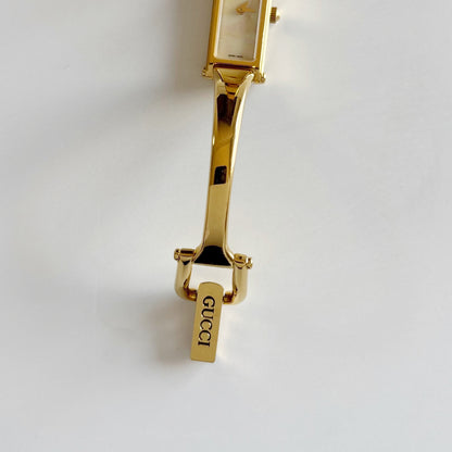Gucci 1990s Rectangular Seashell Dial Gold Plated Bangle Watch