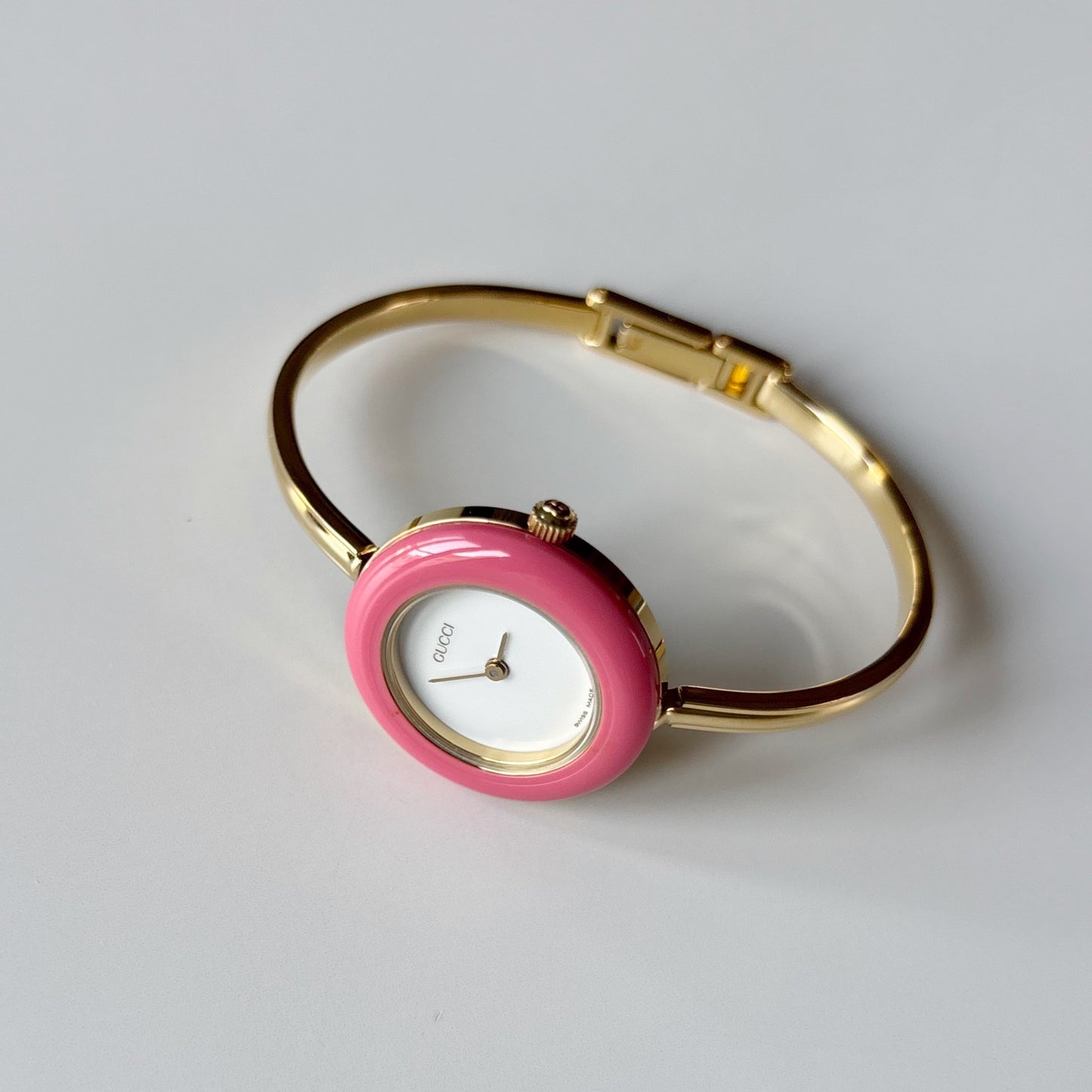 Gucci 1990s Interchangeable Bezel Gold Plated Bangle Watch with case, 12 bezels