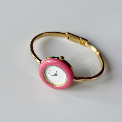 Gucci 1990s Interchangeable Bezel Gold Plated Bangle Watch with case, 12 bezels