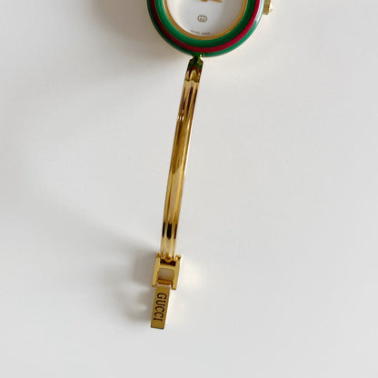 Gucci 1990s Interchangeable Bezel Gold Plated Bangle Watch with 12 bezels, case