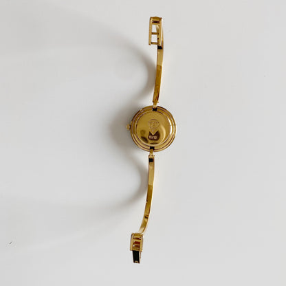 Gucci 1990s Interchangeable Bezel Gold Plated Bangle Watch with 12 bezels, case