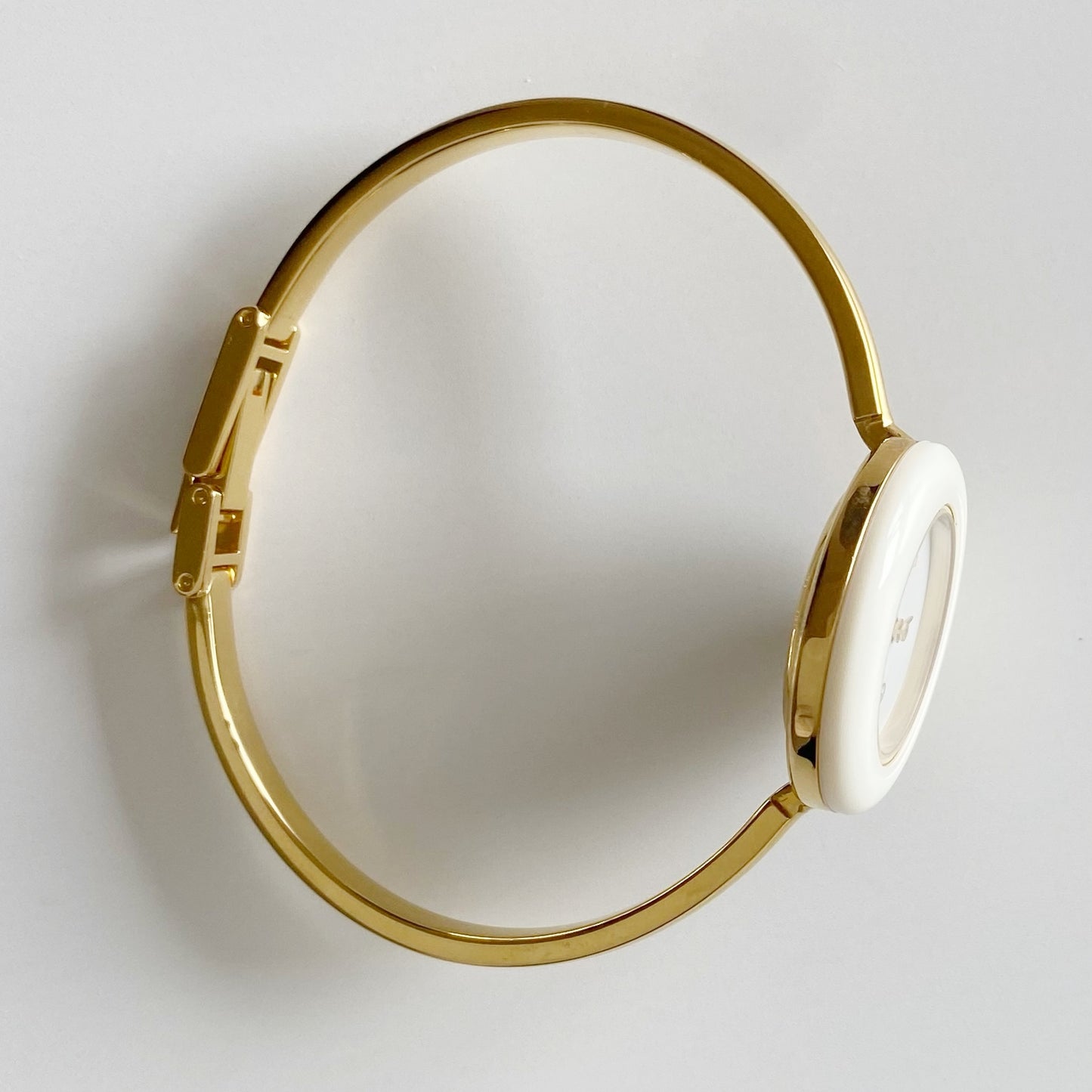 Gucci 1990s Interchangeable Bezel Gold Plated Bangle Watch with 12 bezels, case