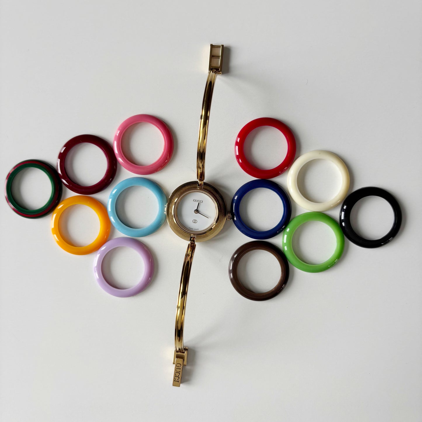 Gucci 1990s Interchangeable Bezel Gold Plated Bangle Watch with 12 bezels, case