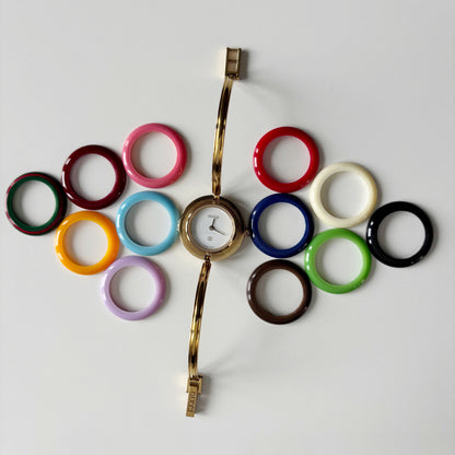 Gucci 1990s Interchangeable Bezel Gold Plated Bangle Watch with 12 bezels, case