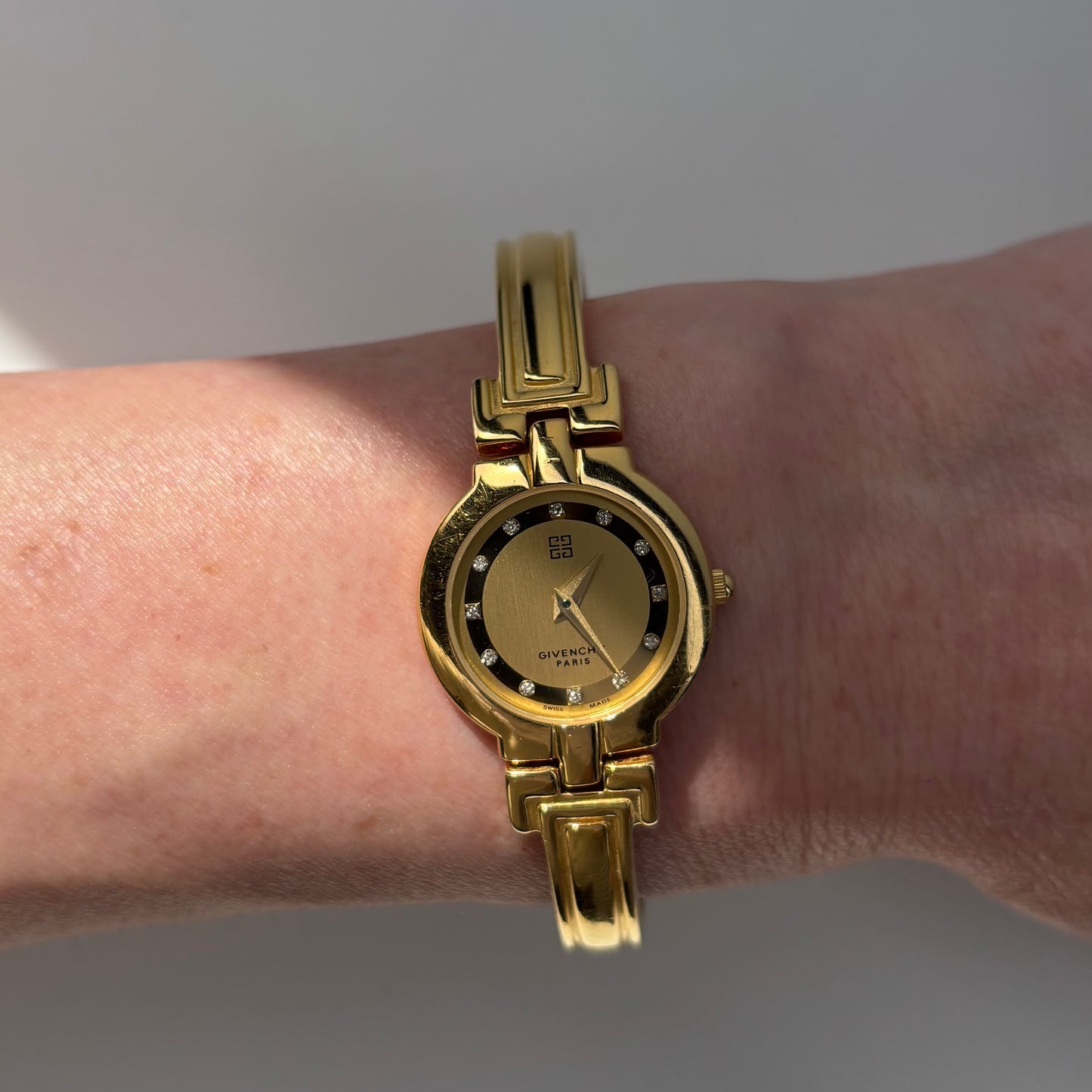 Givenchy 1990s Round Dial Gold Plated Bangle Watch
