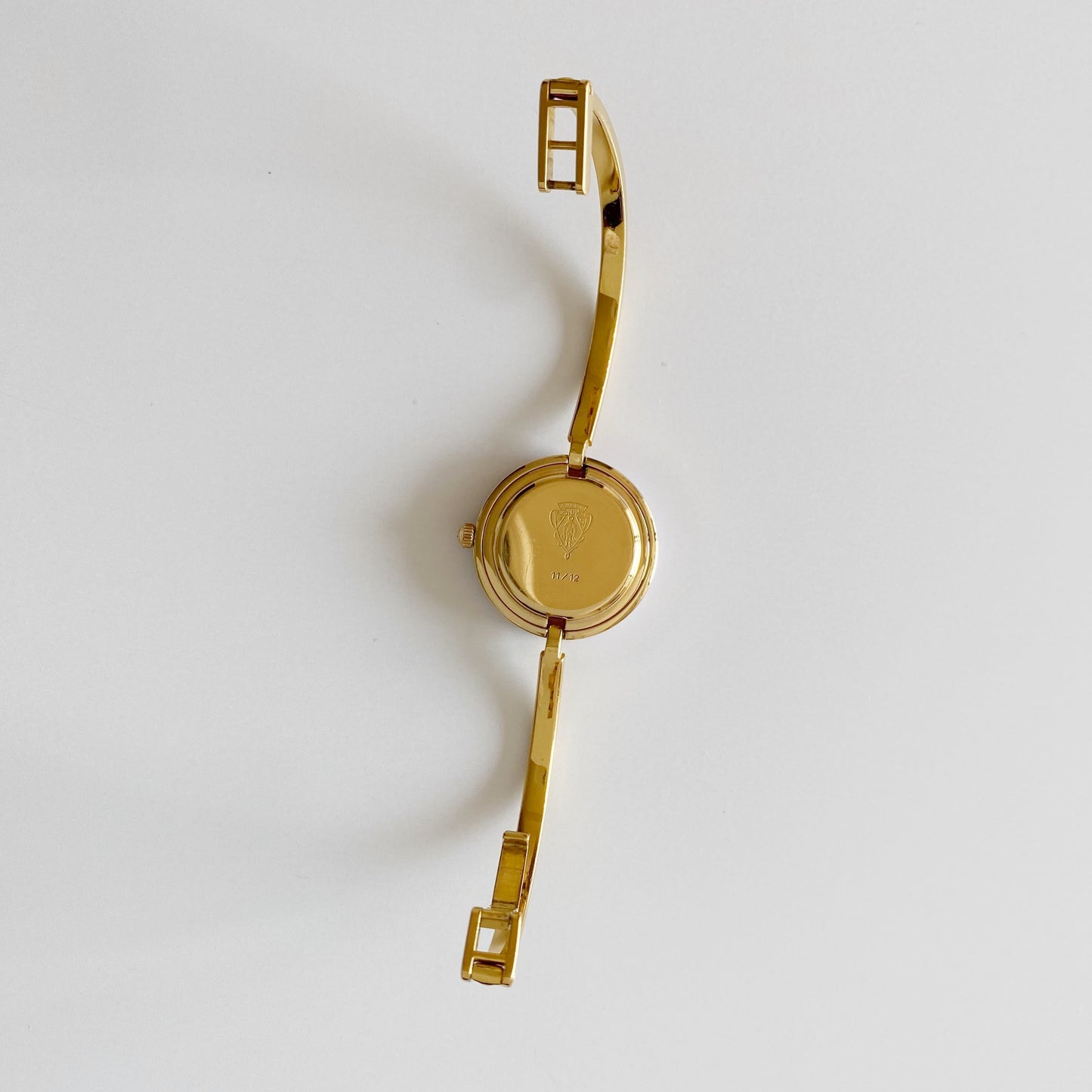 Gucci 1990s Interchangeable Bezel Gold Plated Bangle Watch with 12 bezels, case