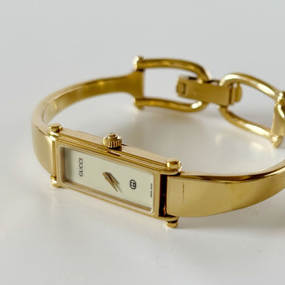 Gucci 1990s Cream Dial Rectangular Gold Plated Bangle Watch
