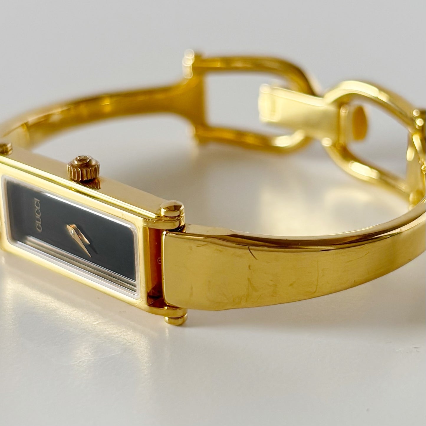 Gucci 1990s Black Rectangular Dial Gold Plated Bangle Watch