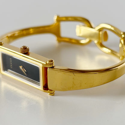 Gucci 1990s Black Rectangular Dial Gold Plated Bangle Watch