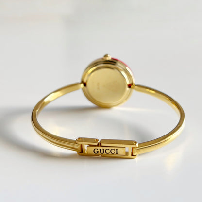 Gucci 1990s Interchangeable Bezel Gold Plated Bangle Watch with 12 bezels, case