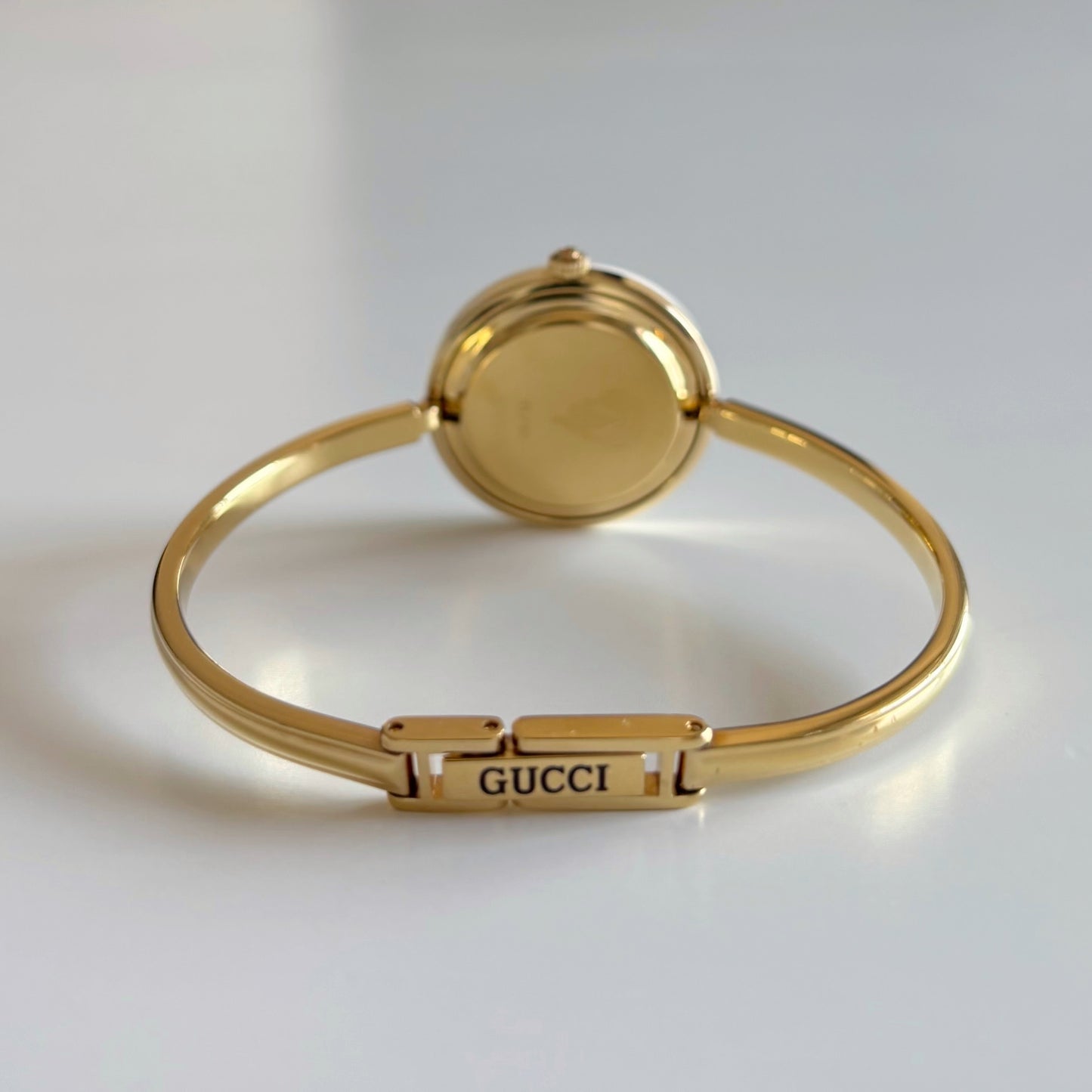Gucci 1990s Interchangeable Bezel Gold Plated Bangle Watch with 12 bezels, case