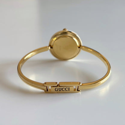 Gucci 1990s Interchangeable Bezel Gold Plated Bangle Watch with 12 bezels, case
