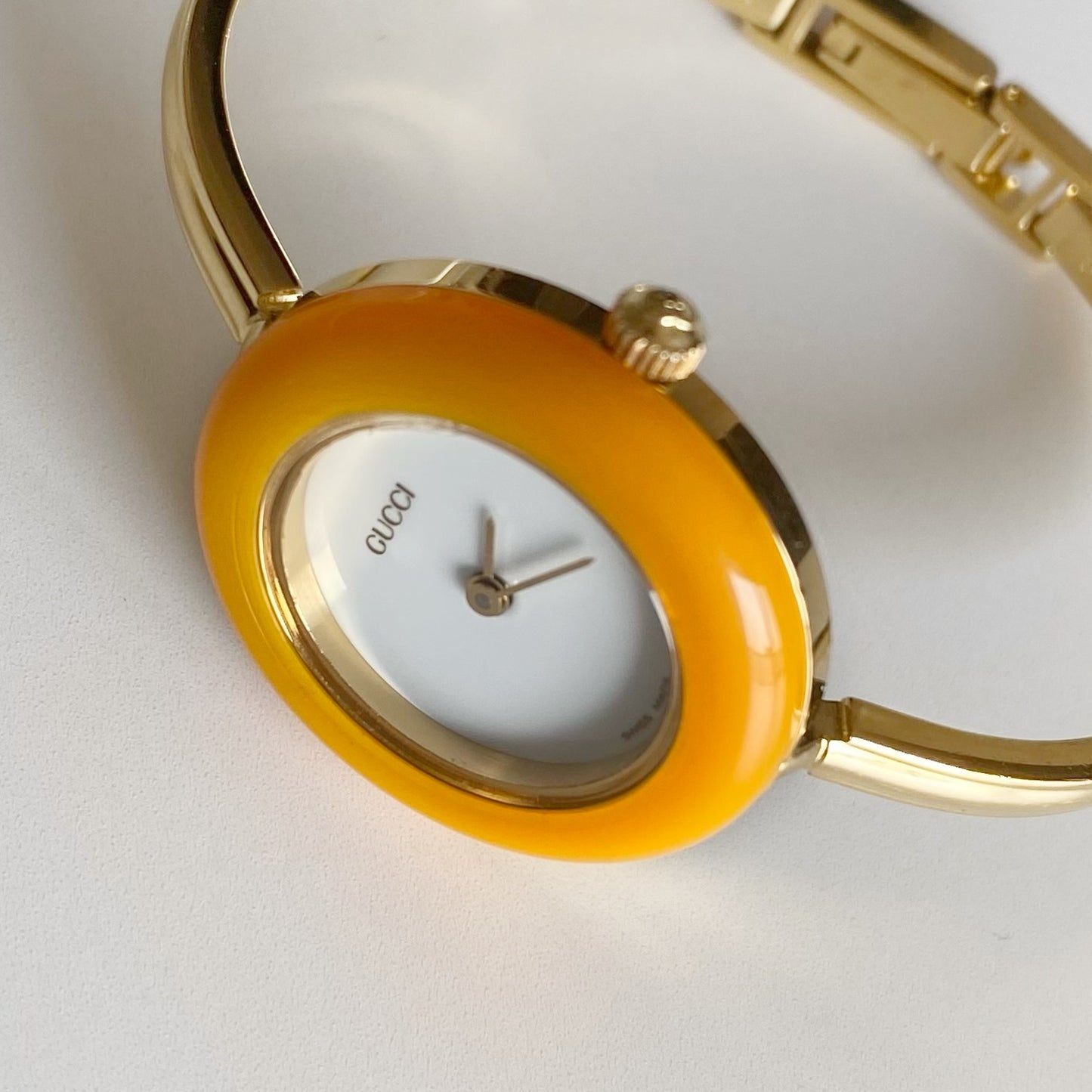 Gucci 1990s Interchangeable Bezel Gold Plated Bangle Watch with 12 bezels, case