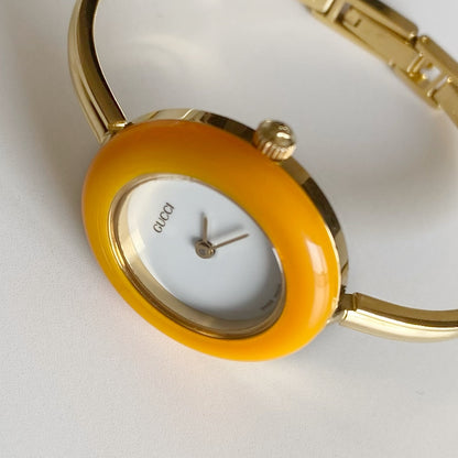 Gucci 1990s Interchangeable Bezel Gold Plated Bangle Watch with 12 bezels, case