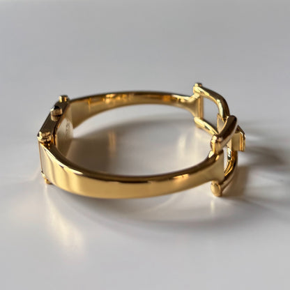 Gucci 1990s Black Rectangular Dial Gold Plated Bangle Watch