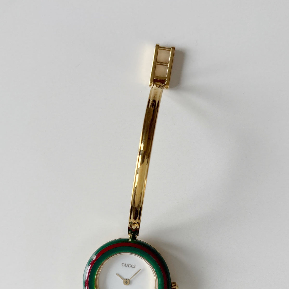 Gucci 1990s Interchangeable Bezel Gold Plated Bangle Watch with 12 bezels, case