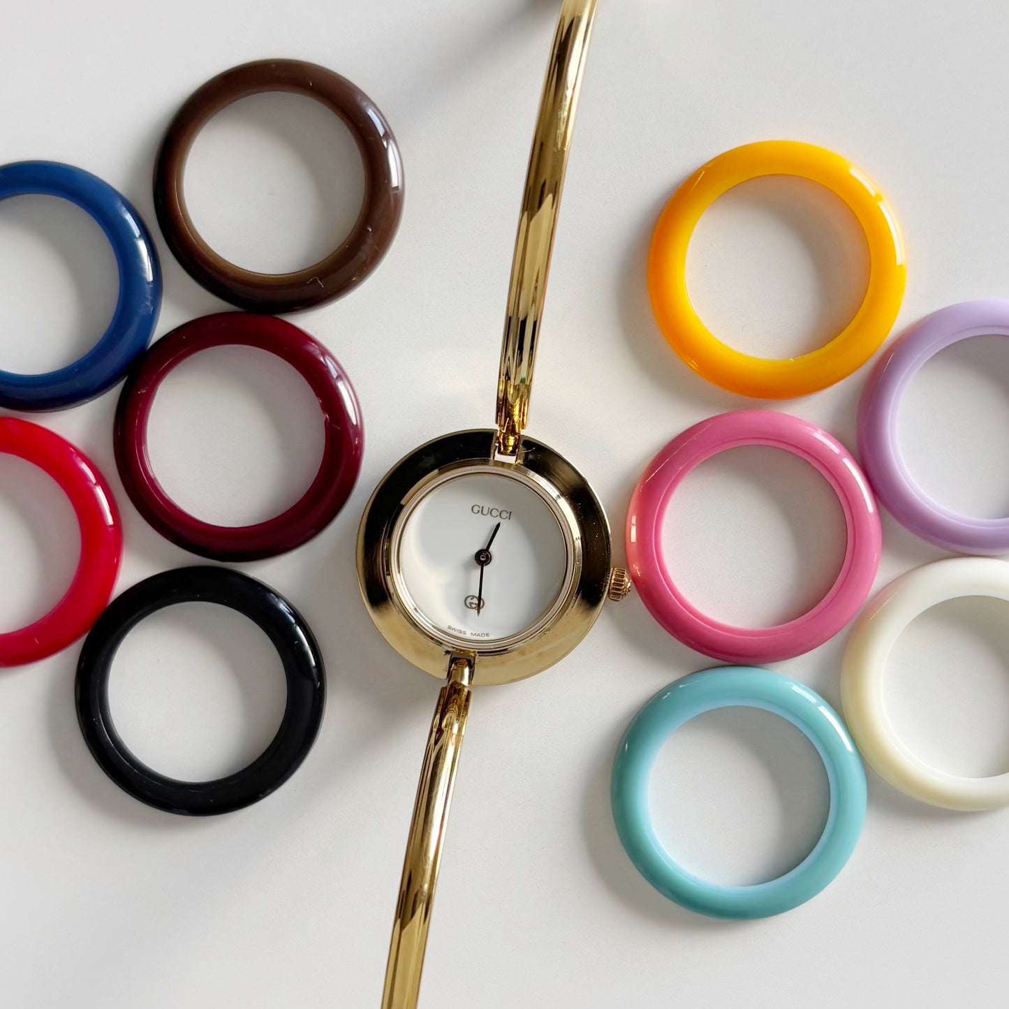 Gucci 1990s Interchangeable Bezel Gold Plated Bangle Watch with 12 bezels, case