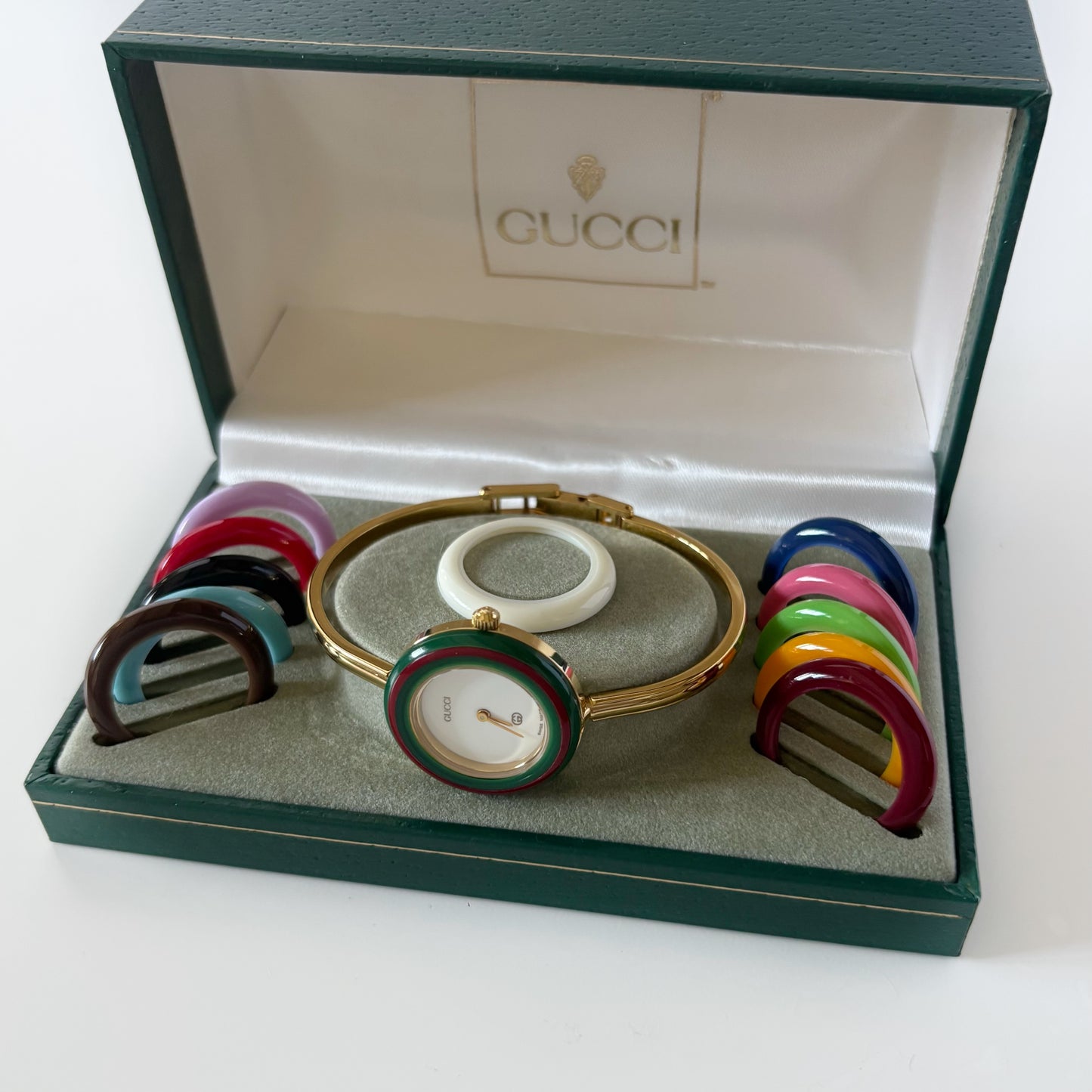 Gucci 1990s Interchangeable Bezel Gold Plated Bangle Watch with 12 bezels, case