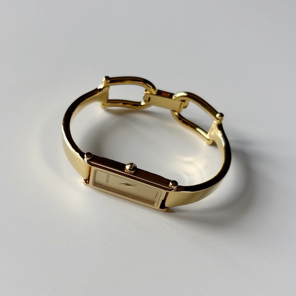 Gucci 1990s Rectangular Gold Dial Gold Plated Bangle Watch (Small)