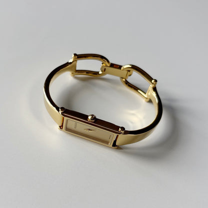 Gucci 1990s Rectangular Gold Dial Gold Plated Bangle Watch (Small)