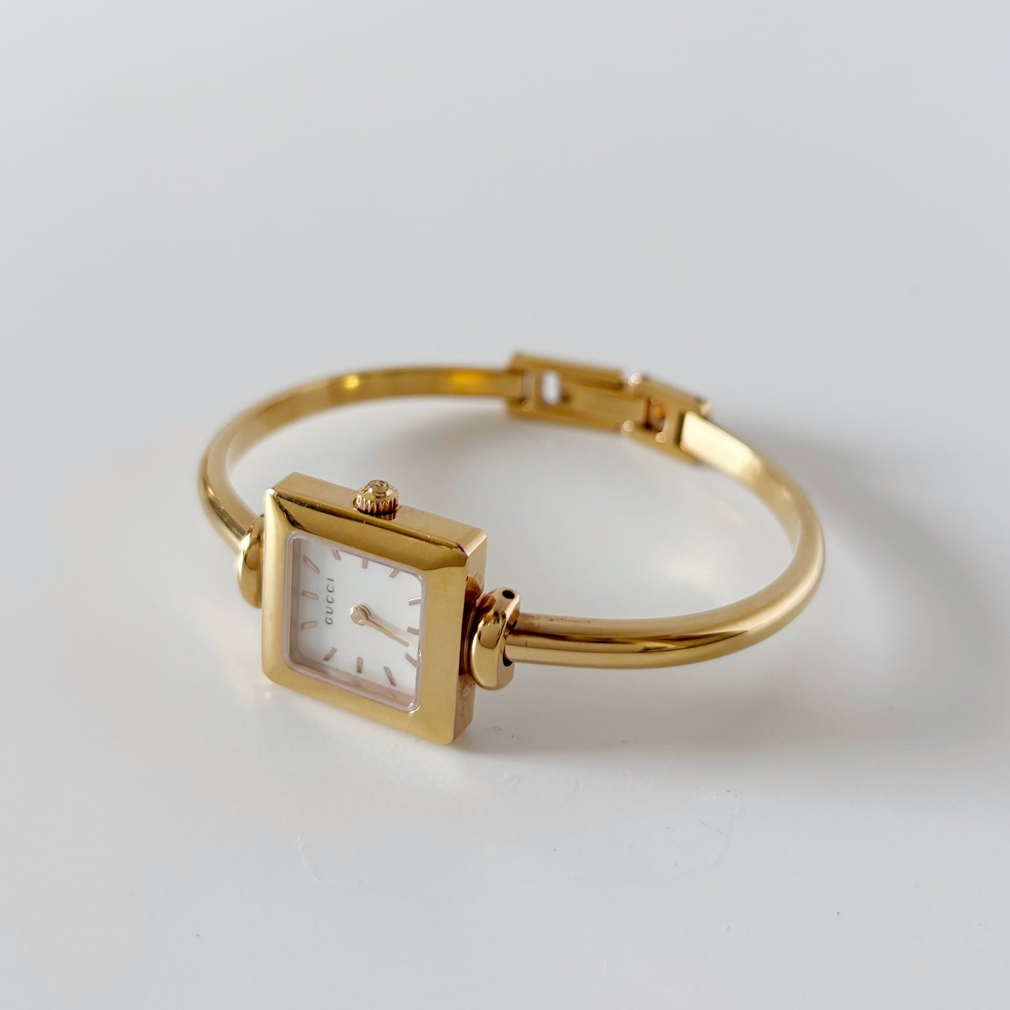 Gucci 1990s Seashell Square Dial Gold Plated Bangle Watch