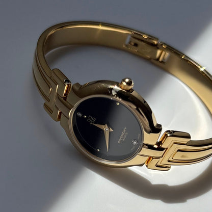 Givenchy 1990s Black Round Dial Gold Plated Bangle Watch