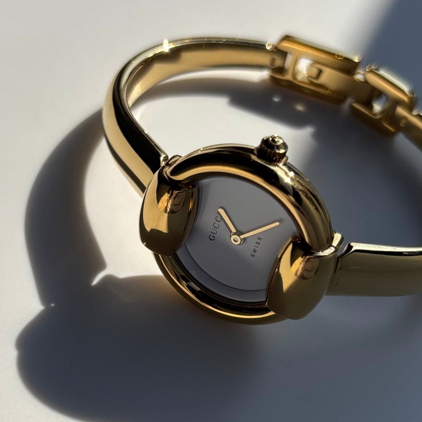 Gucci 1990s Round Dial Gold Plated Bangle Watch (Small)