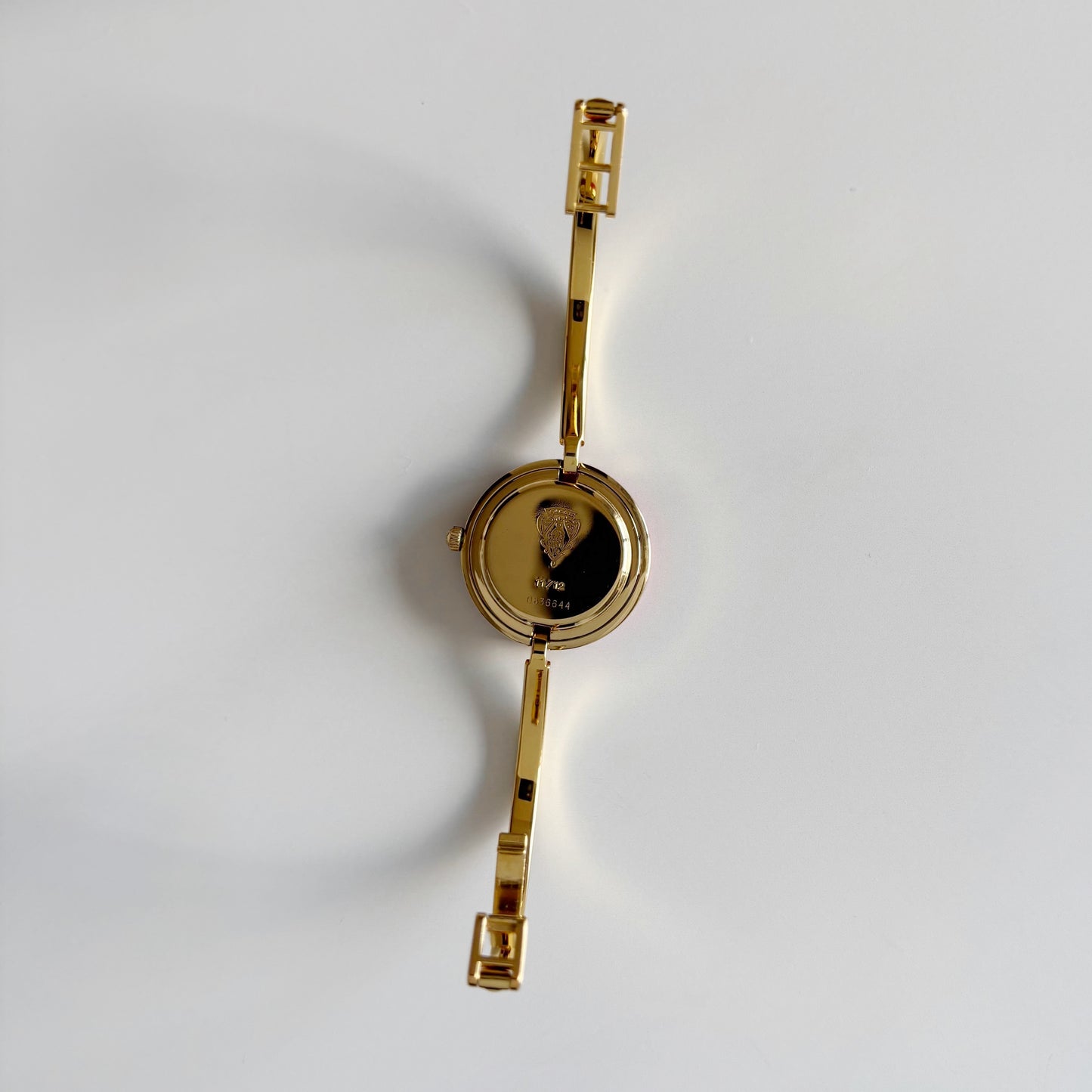 Gucci 1990s Interchangeable Bezel Gold Plated Bangle Watch with 12 bezels, case