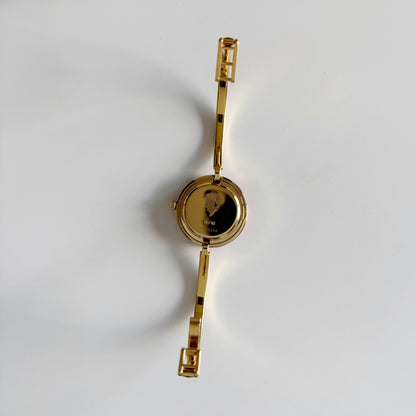 Gucci 1990s Interchangeable Bezel Gold Plated Bangle Watch with 12 bezels, case