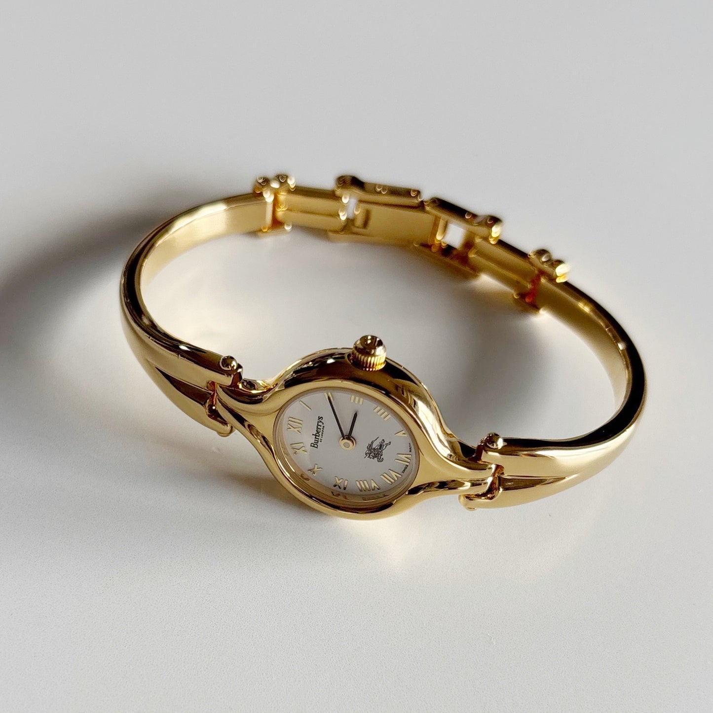 Burberry 1990s Round Dial Gold Plated Bangle Watch