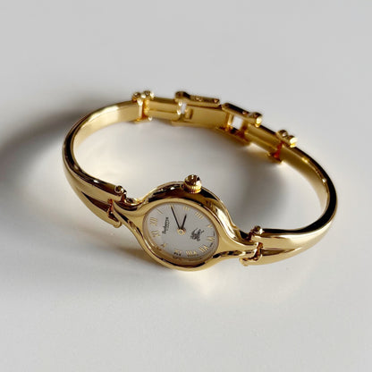 Burberry 1990s Round Dial Gold Plated Bangle Watch