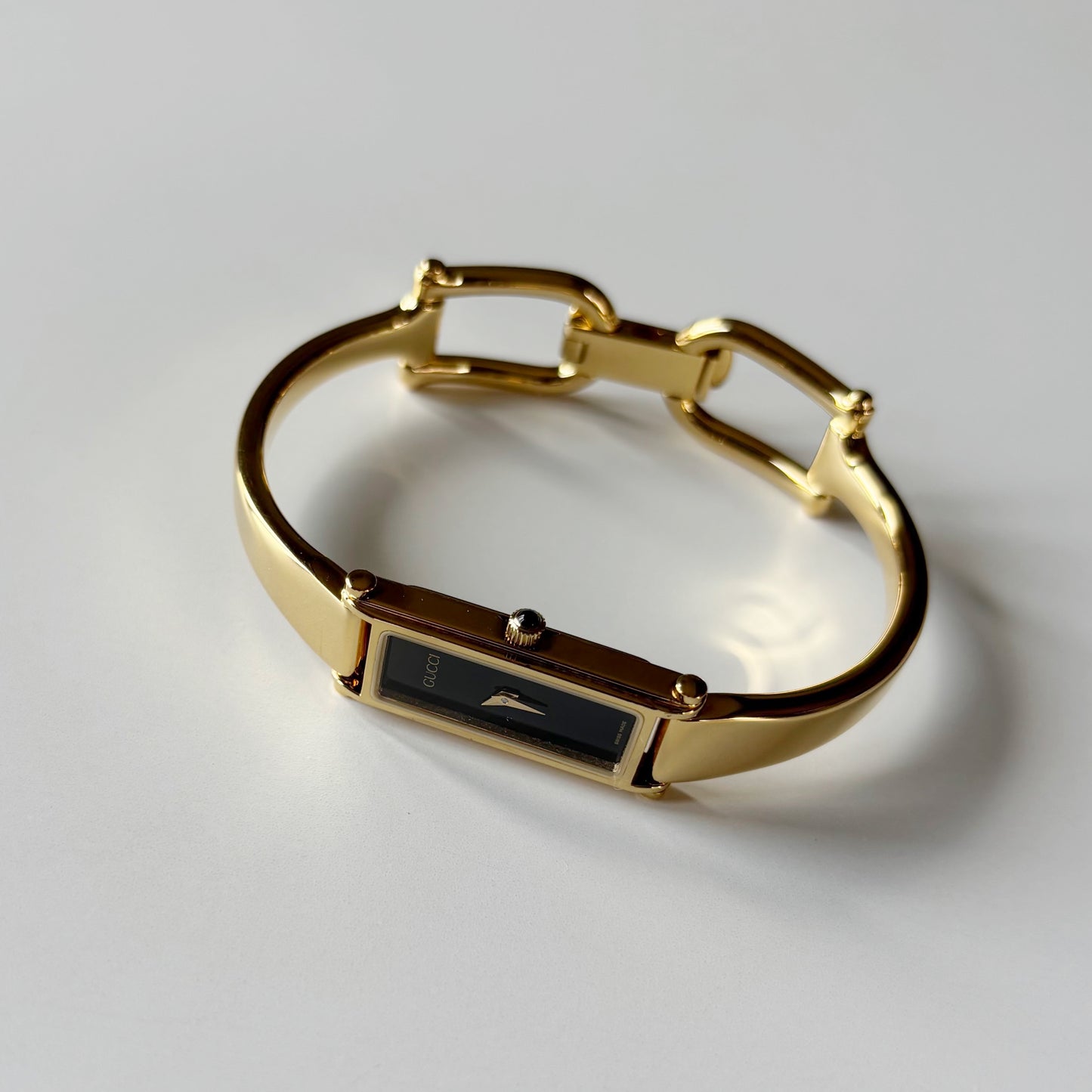 Gucci 1990s Black Rectangular Dial Gold Plated Bangle Watch