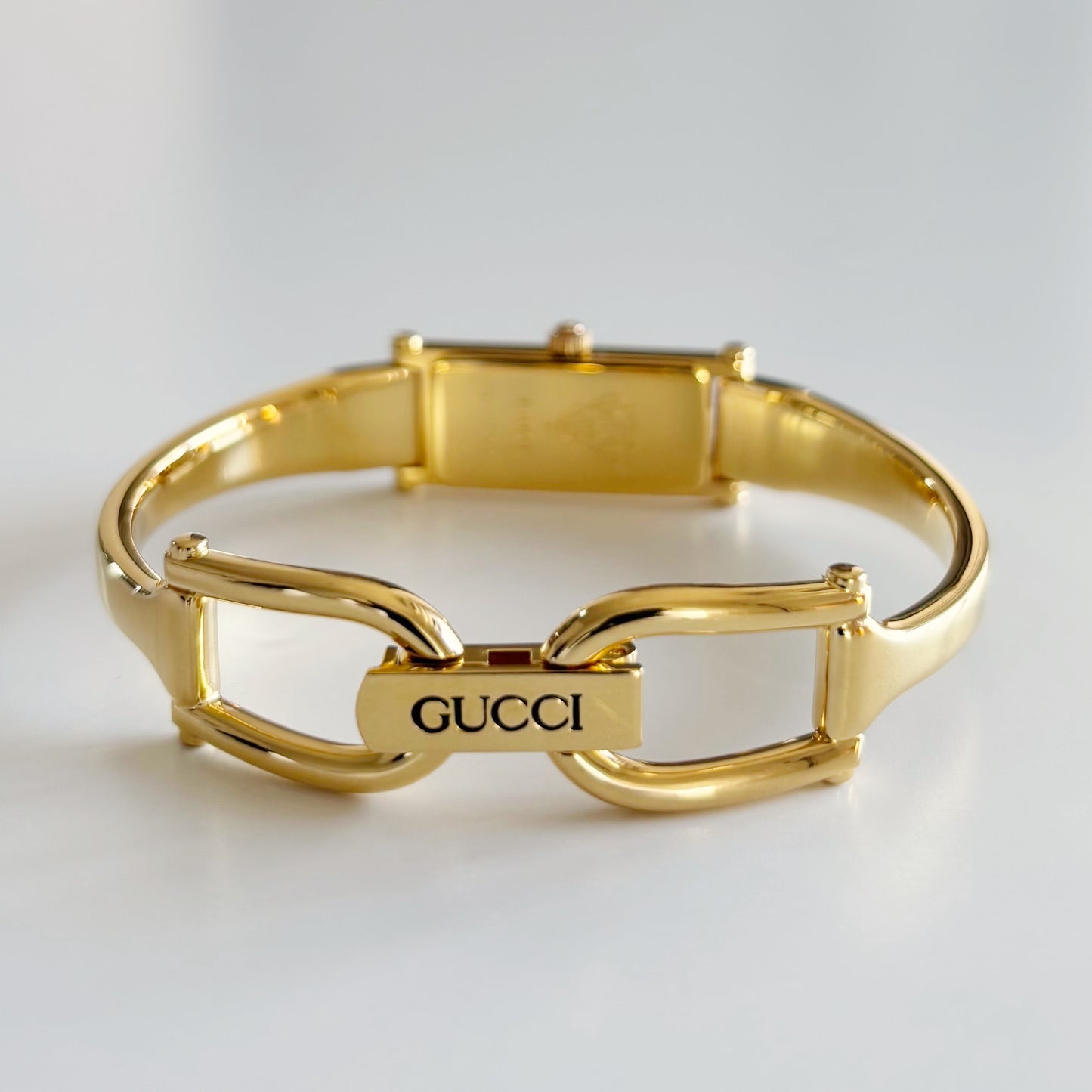 Gucci 1990s Black Rectangular Dial Gold Plated Bangle Watch