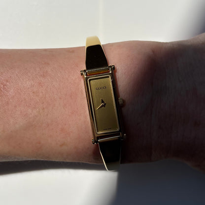 Gucci 1990s Gold Rectangular Dial Gold Plated Bangle Watch