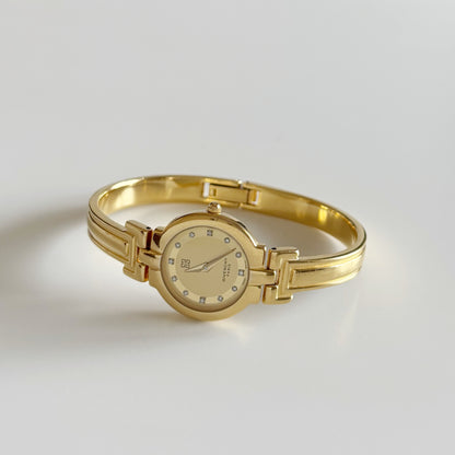 Givenchy 1990s Round Dial Gold Plated Bangle Watch